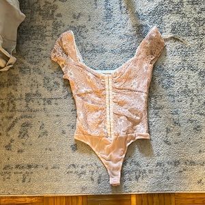 Pink lace body suit